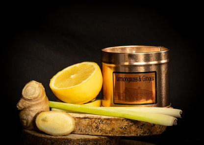 Irish Soy Wax Candle in a copper tin with lemon slices and ginger on a dark background